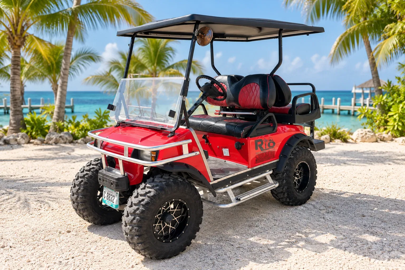 Red four-seat Rio golf cart with black and red seats against an edited coastal background